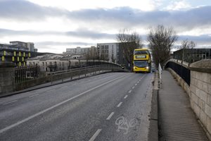 Bus driving over bridge